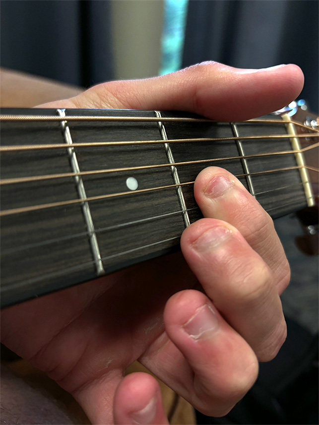 He played guitar in his free time between lunch and dinner.